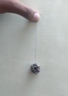 Bobbin tension checking Bobbin tension checking